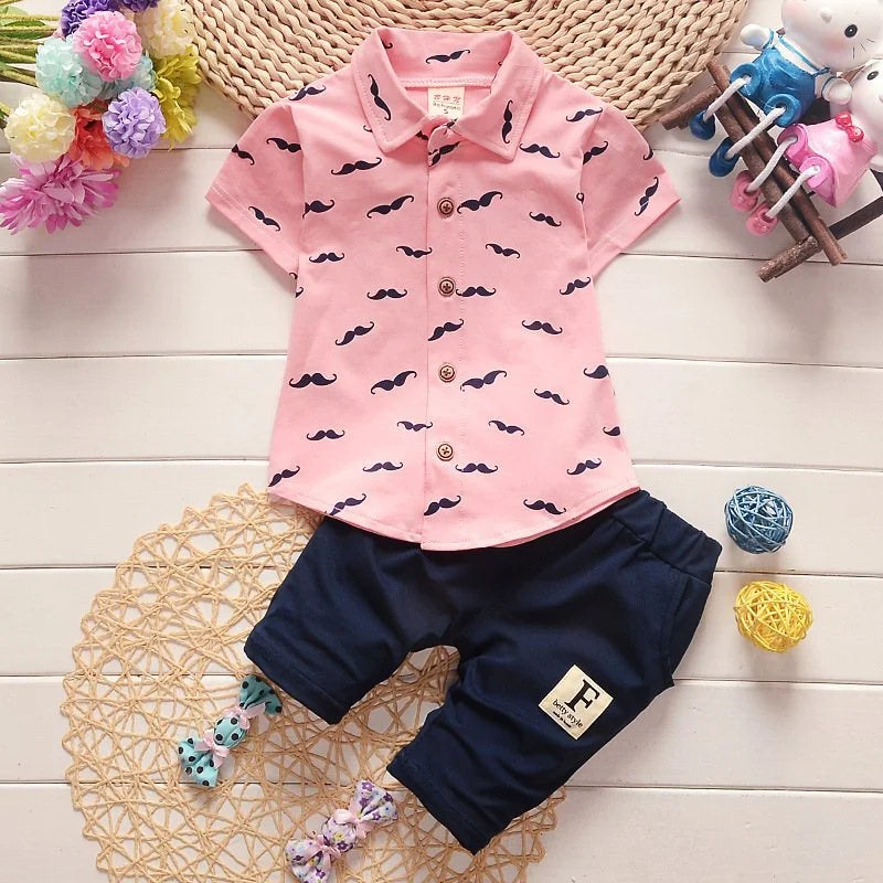 Cute summer outfit for boys — printed short‑sleeve shirt & matching cotton shorts. Perfect for warm days