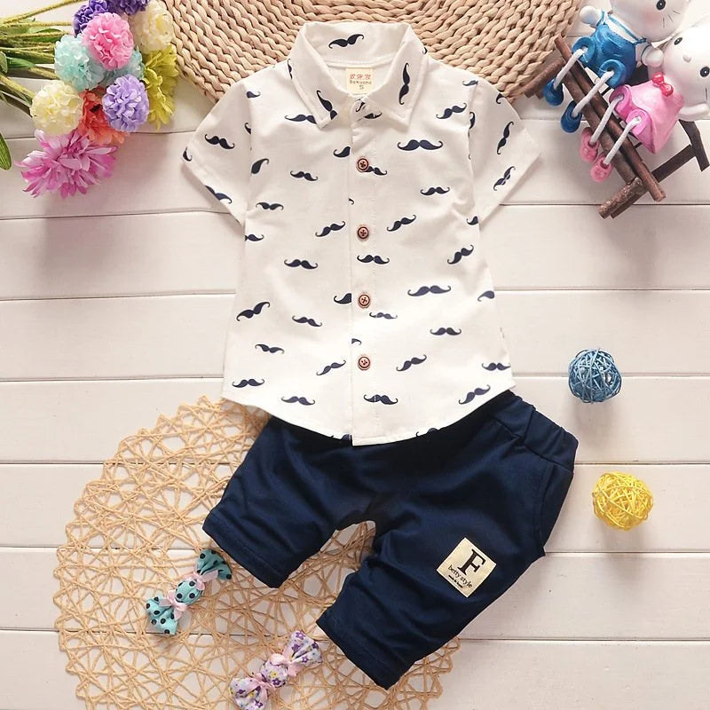 Cute summer outfit for boys — printed short‑sleeve shirt & matching cotton shorts. Perfect for warm days